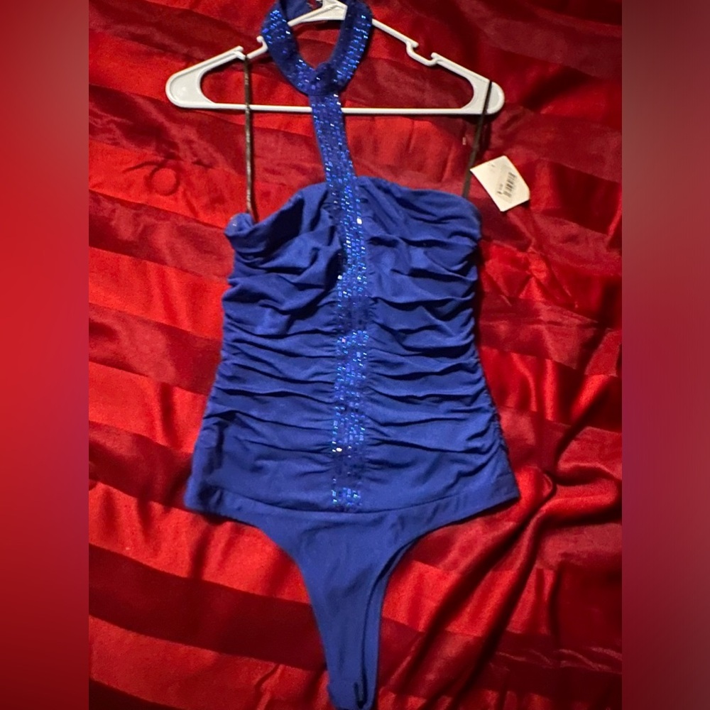 New never worn before Blue Bodysuit. Size medium.